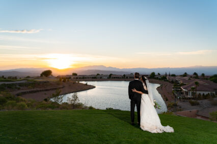 bride and groom watching sunset