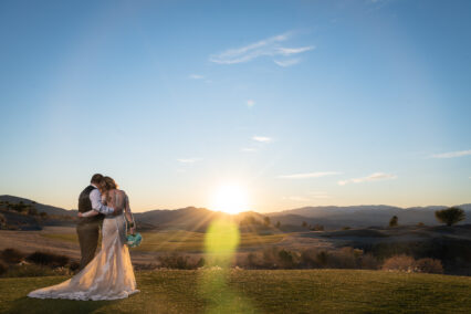 bride and groom watching sunset