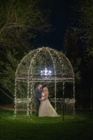 bride and groom at alter