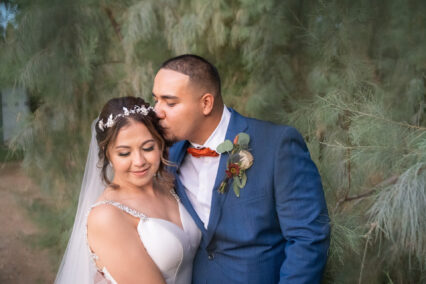 groom kissing bride