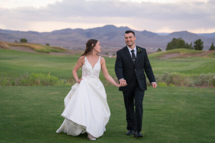 bride and groom in field