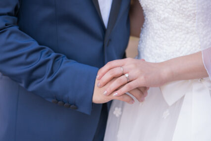 bride and groom holding hands