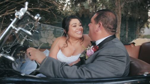 bride and groom in car